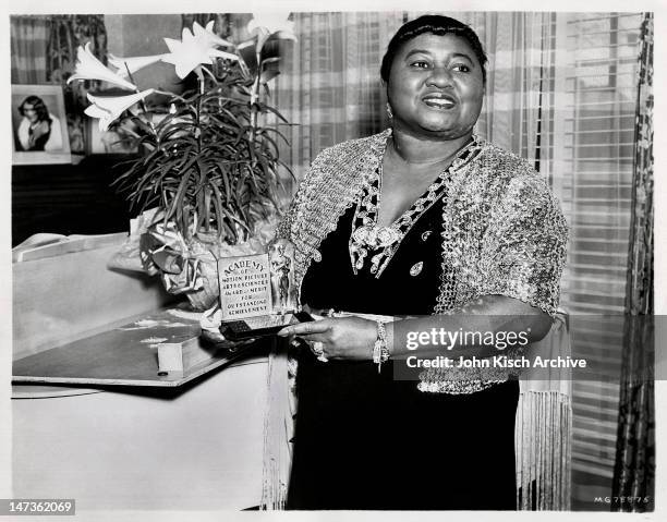 Portrait of American actress Hattie McDaniel holding her Academy Award from the film 'Gone With the Wind,' Hollywood, California, 1940.