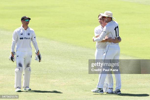 Hilton Cartwright and Ashton Turner of Western Australia celebrate the wicket of Campbell Kellaway of Victoria during the Sheffield Shield match...