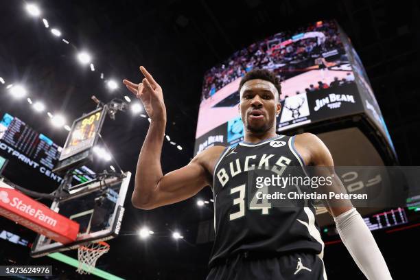 Giannis Antetokounmpo of the Milwaukee Bucks reacts after drawing a foul against the Phoenix Suns during the second half of the NBA game at Footprint...