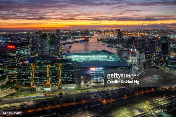 docklands precinct in melbourne, australia at dusk - bay arena stock pictures, royalty-free photos & images