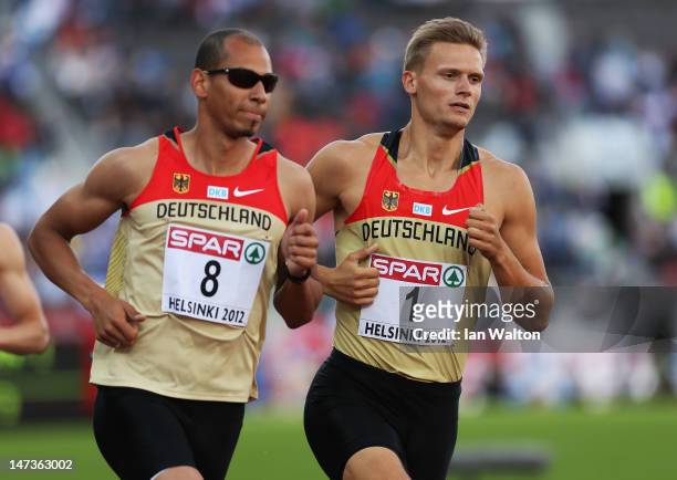 Norman Muller of Germany and Pascal Behrenbruch of Germany compete in the Men's Decathlon 1500m during day two of the 21st European Athletics...