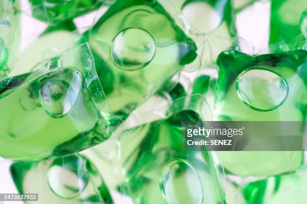 full frame shot of blue liquid laundry detergent pods - detergent powder stock pictures, royalty-free photos & images