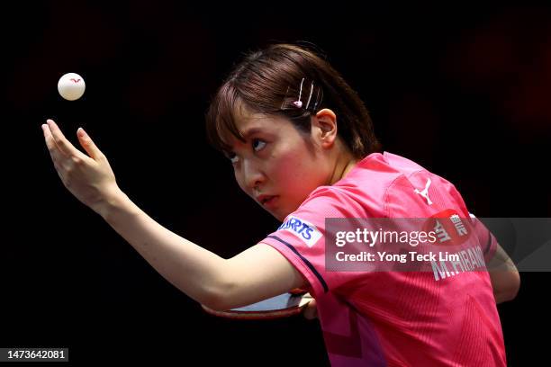 Miu Hirano of Japan serves against Zhang Rui of China in their women's singles round of 16 match during the WTT Singapore Smash at the OCBC Arena on...