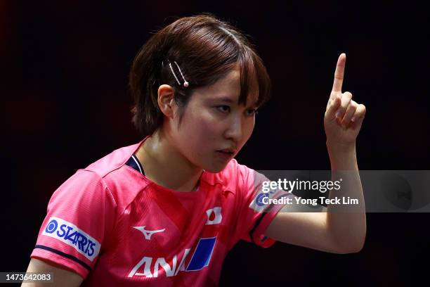 Miu Hirano of Japan celebrates a point against Zhang Rui of China in their women's singles round of 16 match during the WTT Singapore Smash at the...