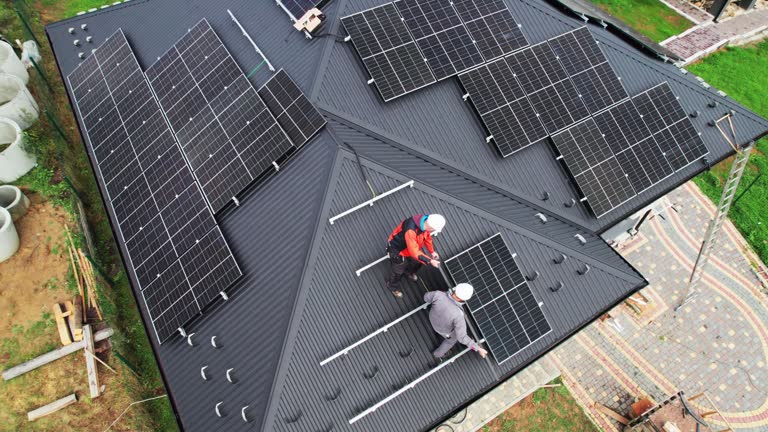 https://media.gettyimages.com/id/1473652178/video/technicians-carrying-photovoltaic-solar-module-while-installing-solar-panel-system-on-roof-of.jpg?b=1&s=640x640&k=20&c=gJSBOqkuY75snx64wdPd5b7Cz2TRmgOASwp0R346Vm0=