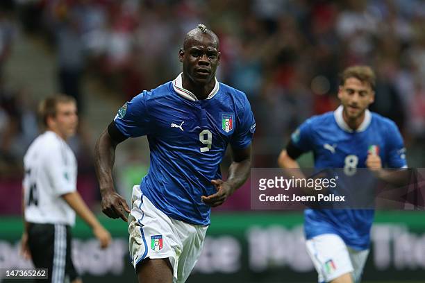 Mario Balotelli of Italy celebrates scoring the opening goal during the UEFA EURO 2012 semi final match between Germany and Italy at the National...