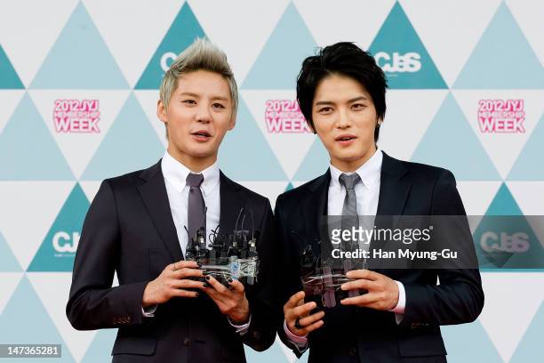 Kim Jun-Su and Kim Jae-Joong of South Korean boy band JYJ attend during the '2012 JYJ Membership Week' opening ceremony held at Setec on June 28,...