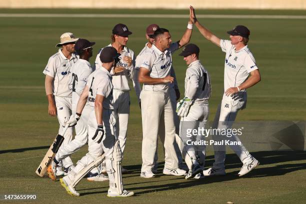 Scott Boland of Victoria celebrates the wicket of Cameron Bancroft of Western Australia during the Sheffield Shield match between Western Australia...
