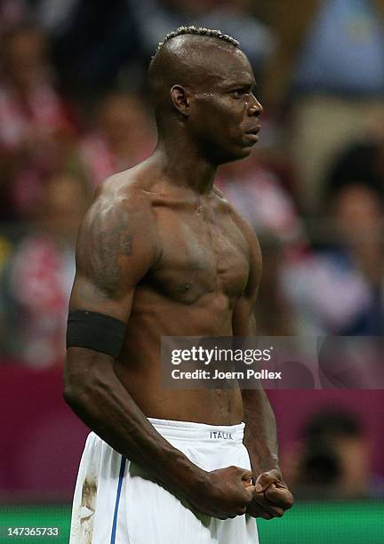 Mario Balotelli of Italy celebrates after scoring his team's second goal during the UEFA EURO 2012 semi final match between Germany and Italy at the...