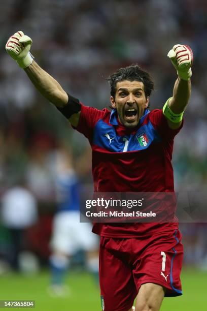Gianluigi Buffon of Italy celebrates after team-mate Mario Balotelli scored his team's second goal during the UEFA EURO 2012 semi final match between...