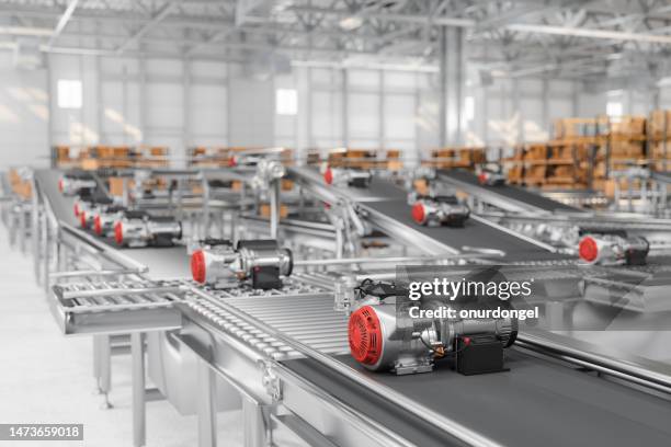 close-up view of electrical motors on conveyor belt - conveyer belt stockfoto's en -beelden