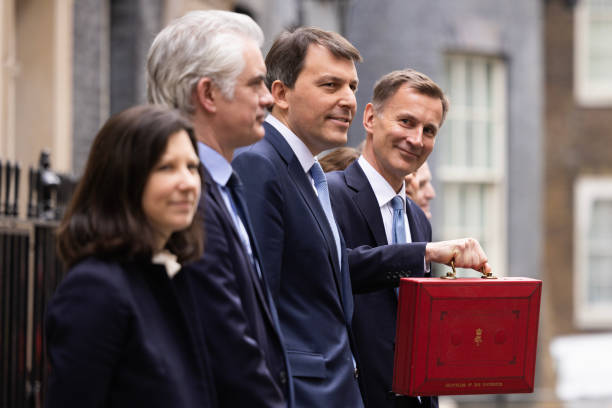 Chancellor Jeremy Hunt leaves Downing Street with the despatch box to present his spring budget to parliament on March 15, 2023 in London, England....