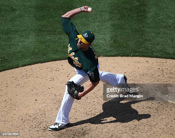 Grant Balfour of the Oakland Athletics pitches during the game against the New York Yankees on May 27, 2012 at The Coliseum in Oakland, California....