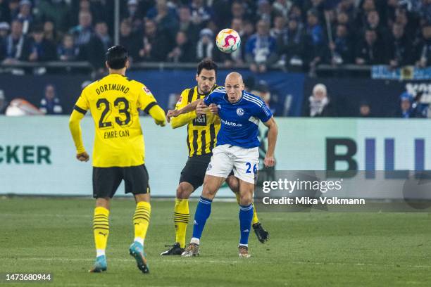 Michael Frey of Schalke challenges Mats Hummels of Dortmund during the Bundesliga match between FC Schalke 04 and Borussia Dortmund at Veltins-Arena...