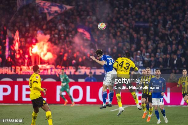 Cedric Christian Brunner jumps for a header against Jamie Jermaine Bynoe-Gittens of Dortmund during the Bundesliga match between FC Schalke 04 and...