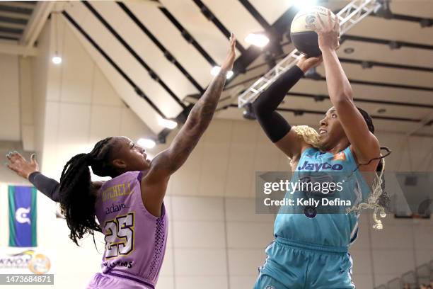 Kayla Thornton of the Flyers shoots against Tiffany Mitchell of the Boomers during the round three WNBL match between Southside Flyers and Melbourne...