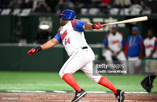 Alfredo Despaigne of Team Cuba hits a ground out with a RBI in the bottom of the 5th inning during the World Baseball Classic quarterfinal between...