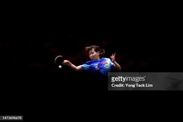 Chen Xingtong of China plays a forehand against Ying Han of Germany in their women's singles round of 16 match during the WTT Singapore Smash at the...