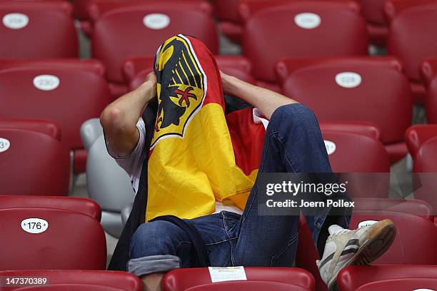 Germany fan shows his dejection after the UEFA EURO 2012 semi final match between Germany and Italy at the National Stadium on June 28, 2012 in...