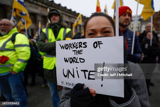 Members from the STUC, UCU, RMT and PCS unions gather on the mound for a rally in support of workers striking for better pay and conditions on March...