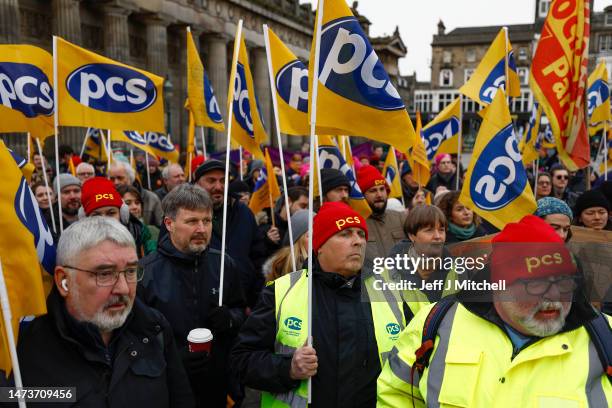 Members from the STUC, UCU, RMT and PCS unions gather on the mound for a rally in support of workers striking for better pay and conditions on March...