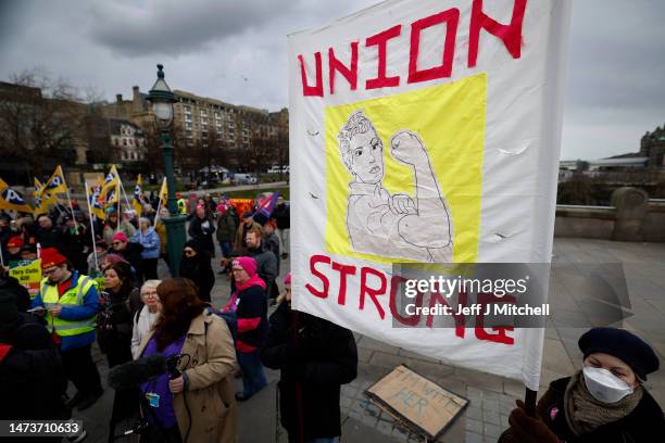 Members from the STUC, UCU, RMT and PCS unions gather on the mound for a rally in support of workers striking for better pay and conditions on March...