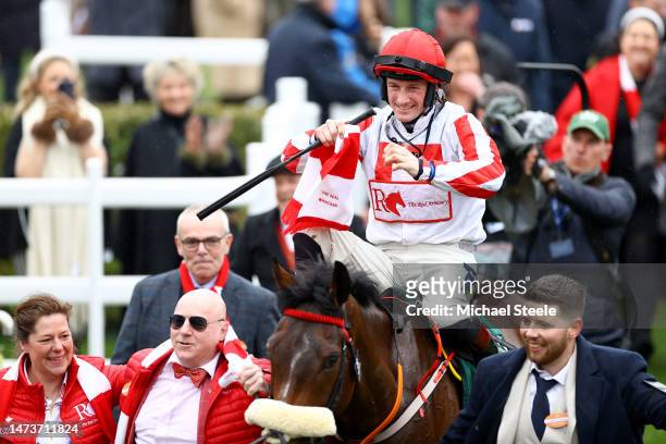 Sam Twiston-Davies riding The Real Whacker celebrates winning the Brown Advisory Novices' Chase during day two of the Cheltenham Festival 2023 at...