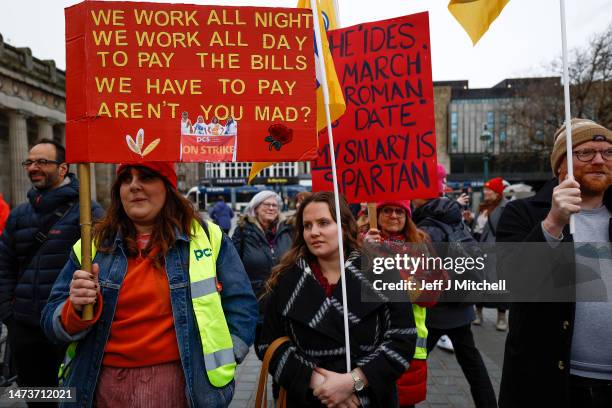 Members from the STUC, UCU, RMT and PCS unions gather on the mound for a rally in support of workers striking for better pay and conditions on March...