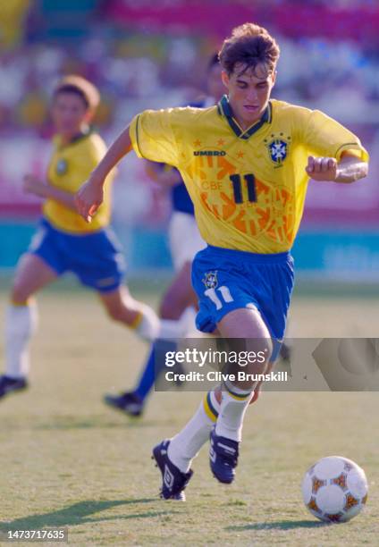 Savio, Left Wing for Brazil dribbles the ball upfield during the Men's Olympic Football Tournament Group D match against Japan at the XXVI Summer...