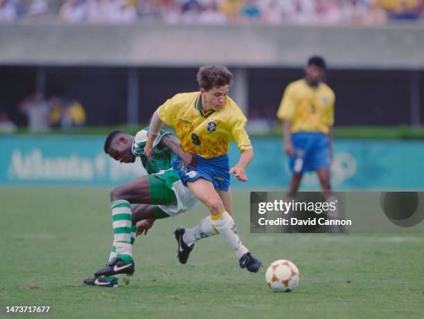 Juninho Paulista, Midfielder for Brazil dribbles the ball upfield during the Men's Olympic Football Tournament Semi-Final match against Nigeria at...