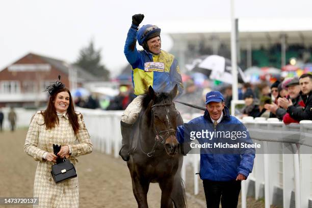 Harry Skelton riding Langer Dan celebrates victory in the Coral Cup Hurdle during day two of the Cheltenham Festival 2023 at Cheltenham Racecourse on...