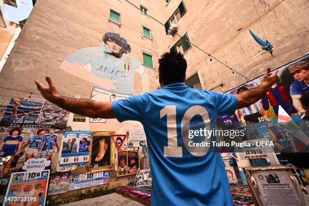 Fan reacts at a Diego Maradona shrine in the city prior to the UEFA Champions League round of 16 leg two match between SSC Napoli and Eintracht...