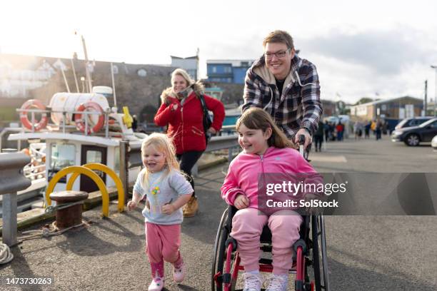 a fun family outing - wheelchair bildbanksfoton och bilder