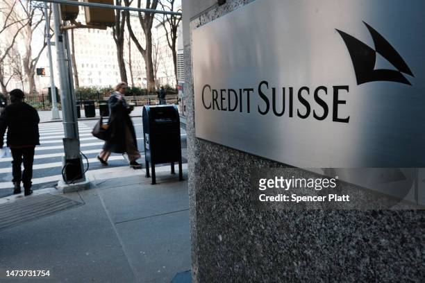 People walk by the New York headquarters of Credit Suisse on March 15, 2023 in New York City. After its largest shareholder said it could not provide...