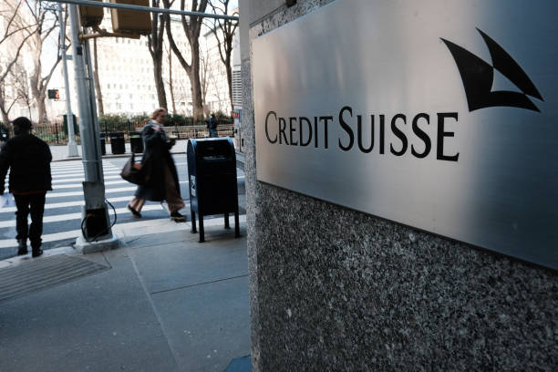 People walk by the New York headquarters of Credit Suisse on March 15, 2023 in New York City. After its largest shareholder said it could not provide...