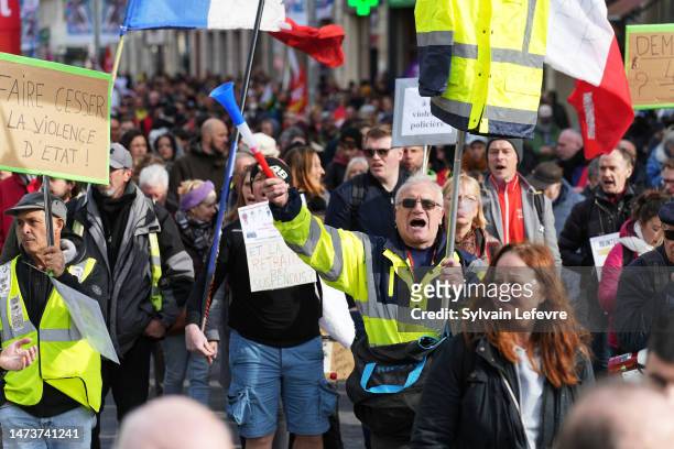 Demonstrators at a protest during a national strike against pension reform on March 15, 2023 in Lille, France.