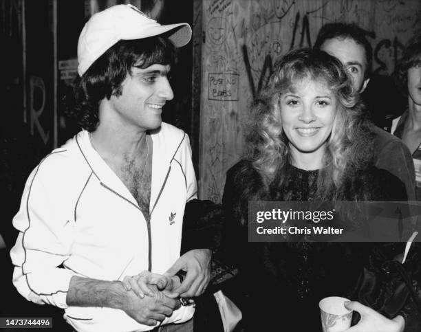 Singer Stevie Nicks and record executive Jimmy Iovine pose for a portrait backstage at a Heart show at the Whisky a Go Go in October 1981 in West...