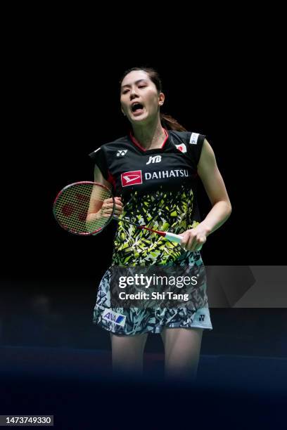 Aya Ohori of Japan reacts in the Women's Singles first round match against Busanan Ongbamrungphan of Thailand on day two of the Yonex All England...