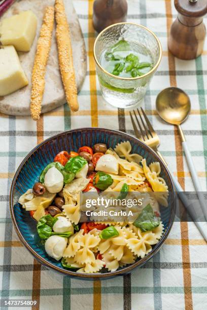 pasta salad mozzarella tomatoes - pasta salad stock pictures, royalty-free photos & images