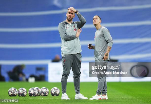 Adrian and Kostas Tsimikas of Liverpool inspect the pitch prior to the UEFA Champions League round of 16 leg two match between Real Madrid and...