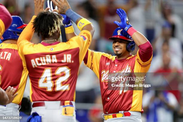 Eduardo Escobar of Team Venezuela celebrates after hitting a home run against Team Israel during the fourth inning of the World Baseball Classic Pool...