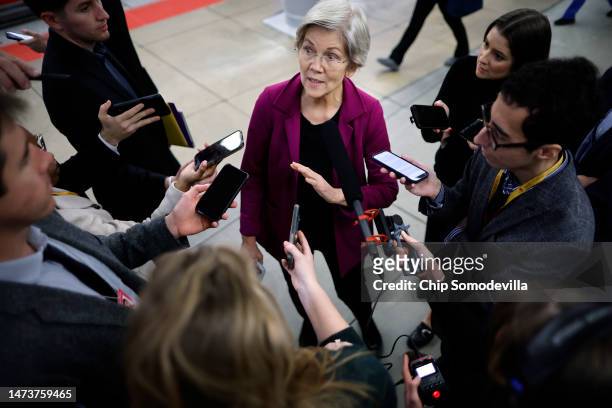 Sen. Elizabeth Warren talks with reporters following the weekly Democratic Senate policy luncheon at the U.S. Capitol on March 15, 2023 in...