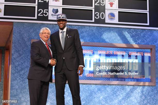 Michael Kidd-Gilchrist shakes hands with NBA Commissioner David Stern after being selected number two overall by the Charlotte Bobcats during the...