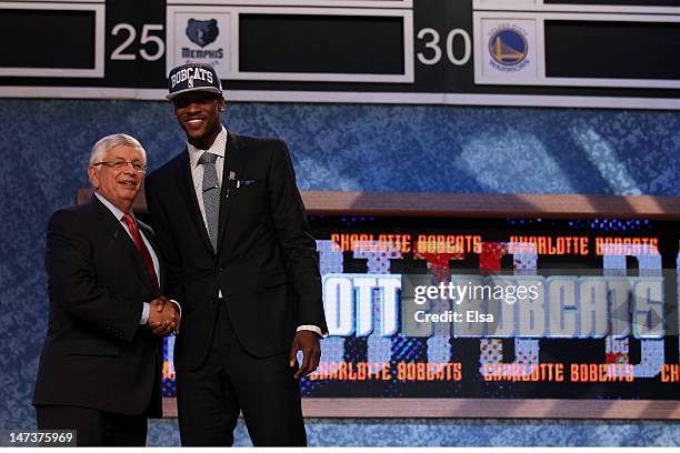 Michael Kidd-Gilchrist of the Kentucky Wildcats greets NBA Commissioner David Stern after he was selected number two overall by the Charlotte Bobcats...