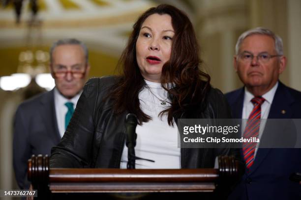 Sen. Tammy Duckworth , an Iraq war veteran who was injured when the helicopter she was piloting was shot down in 2004, talks to reporters with Senate...