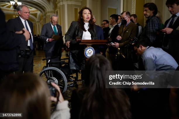 Sen. Tammy Duckworth , an Iraq war veteran who was injured when the helicopter she was piloting was shot down in 2004, talks to reporters with Sen....