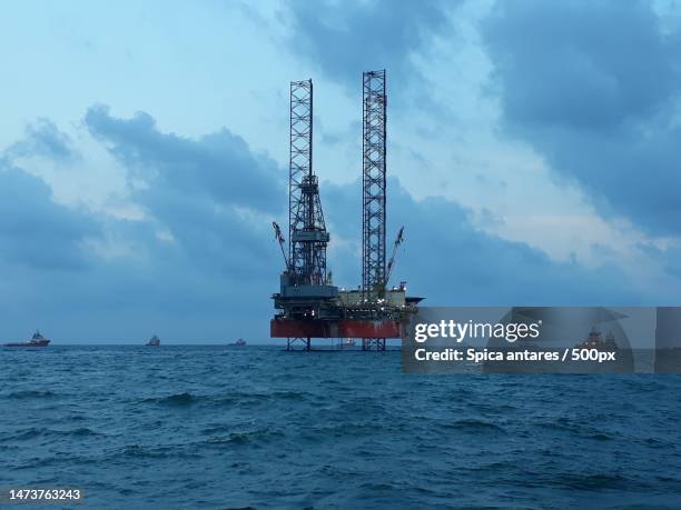 view of sea against cloudy sky,malaysia - borehole stock pictures, royalty-free photos & images