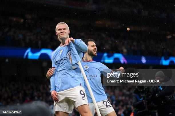 Erling Haaland celebrates with Bernardo Silva after scoring the 2nd Manchester City goal during the UEFA Champions League round of 16 leg two match...