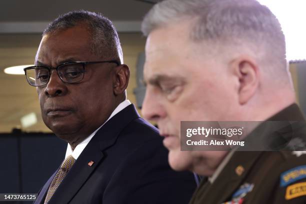 Secretary of Defense Lloyd Austin listens as Chairman of the Joint Chiefs of Staff Army Gen. Mark Milley speaks during a press conference at the...