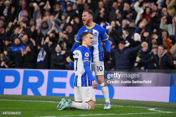 Solly March of Brighton & Hove Albion celebrates after scoring the team's first goal with teammate Alexis Mac Allister during the Premier League...